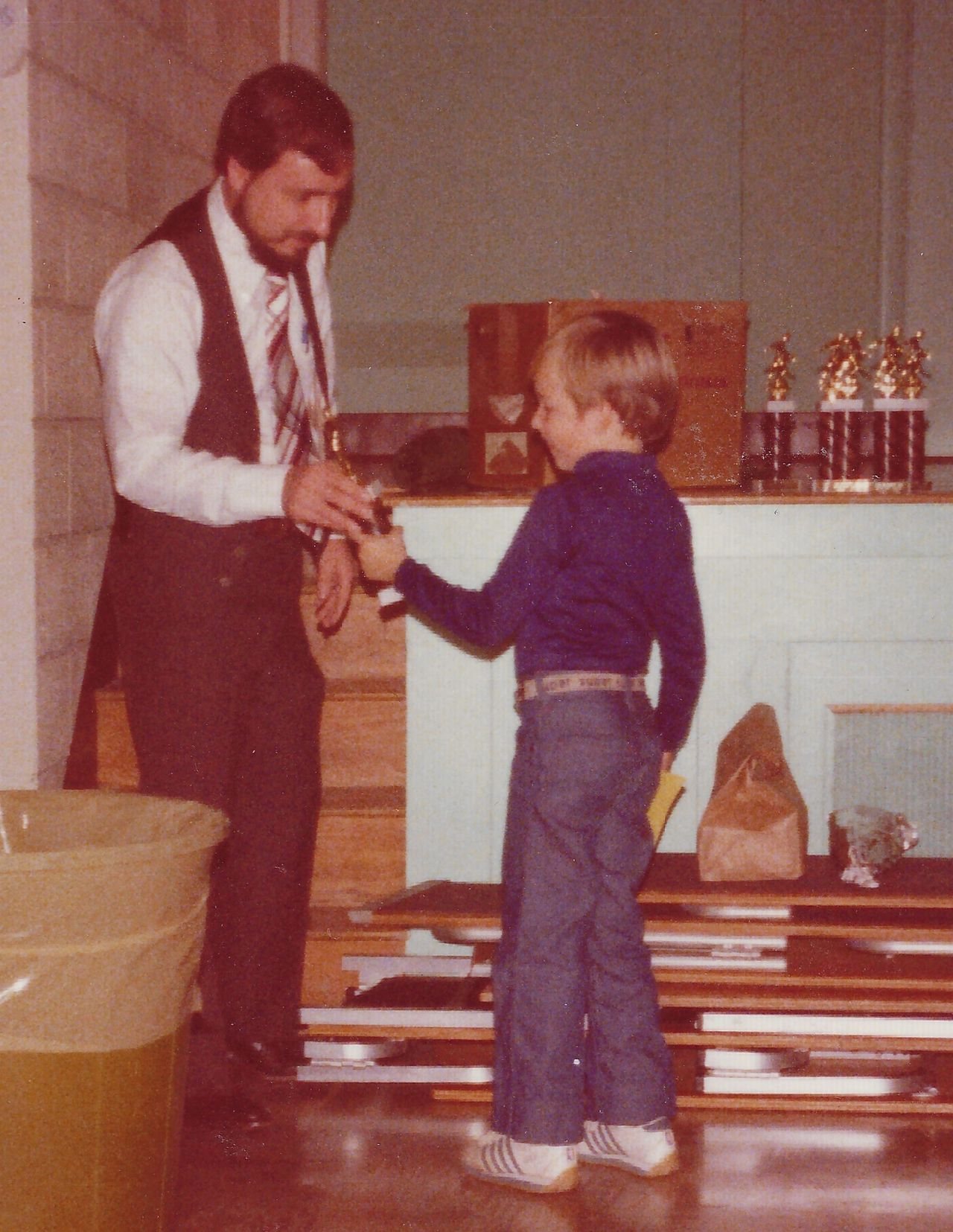 Josh receiving a soccer trophy from his father Josh receiving a soccer trophy from his father
